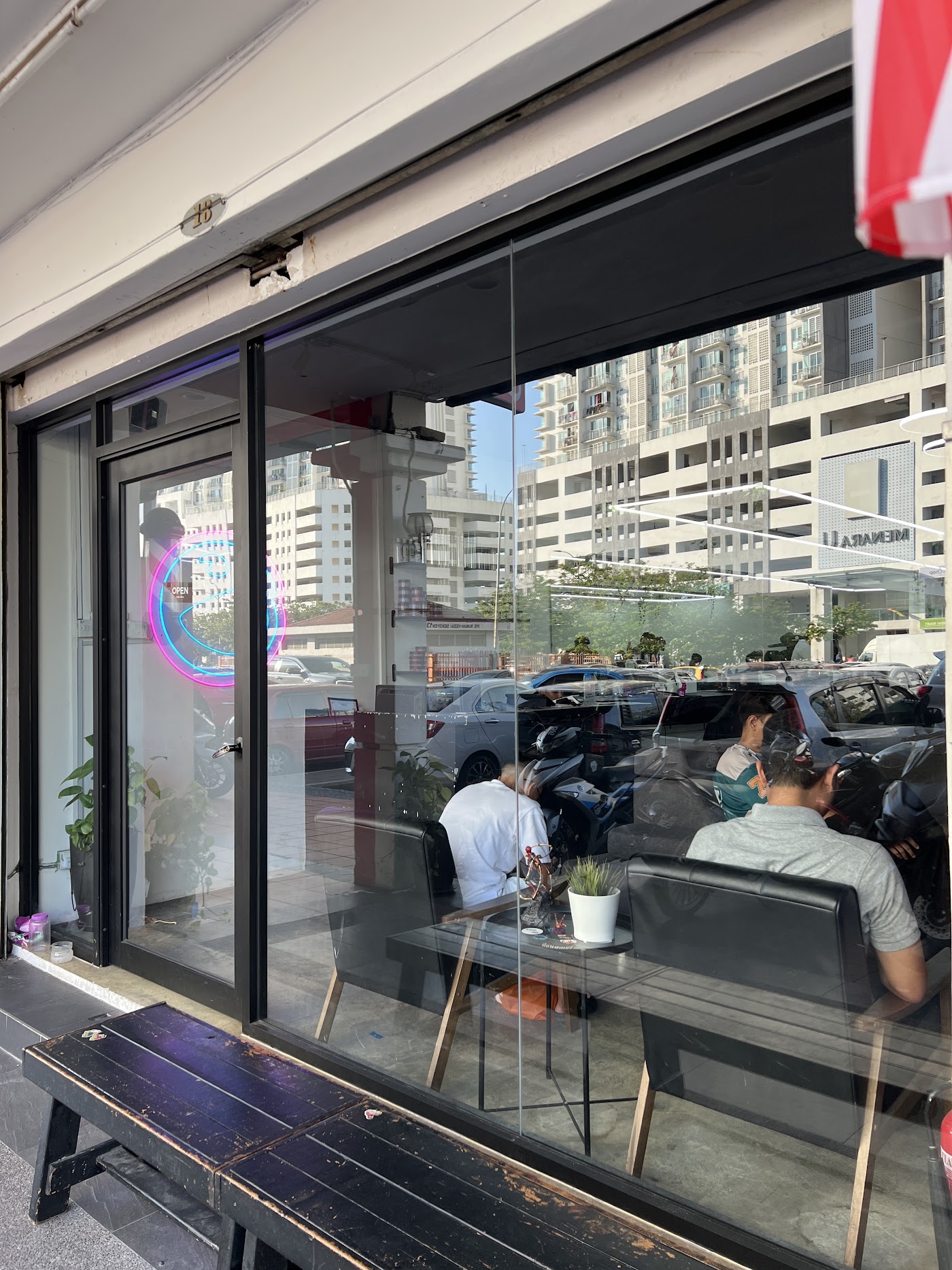 Jawdrop Shah Alam shopfront window with clients seated inside