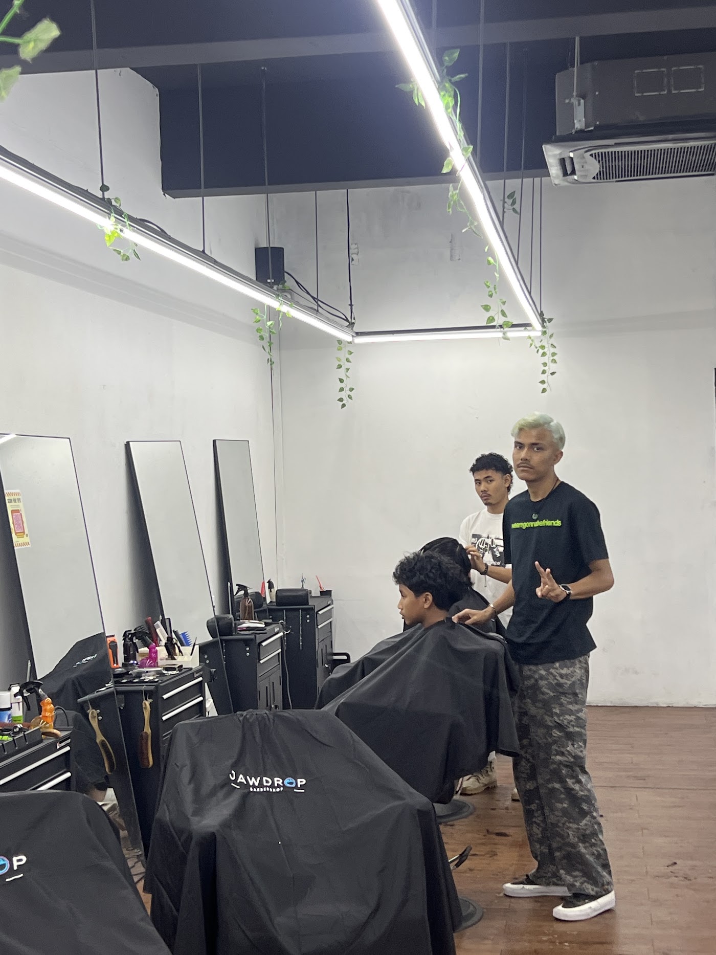 Barbers at work in the Jawdrop Saujana Utama studio