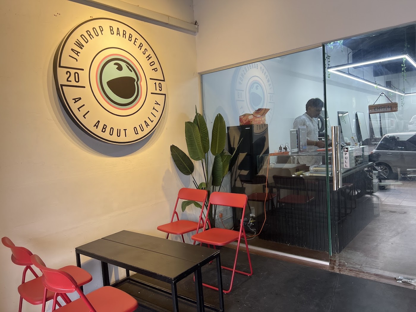 Branded JAWDROP logo wall above the Saujana Utama reception